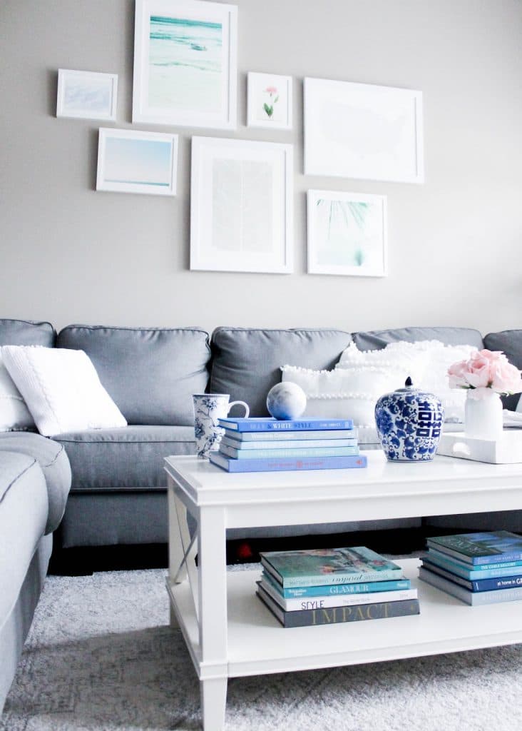 gallery wall, minted art, white frames, white coffee table, pottery barn coffee table, grey sectional sofa, gray sofa, how to create a gallery wall, nature inspired gallery wall, white and grey living room decor, decor ideas, pretty in the pines